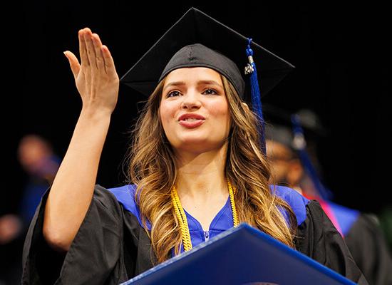 A graduate celebrates at 博彩平台推荐 commencement